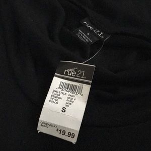 Black short sleeve top with a black belt